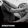 Fight Back ETX donations. A woman defends herself against an attacker pinning her against a wall.